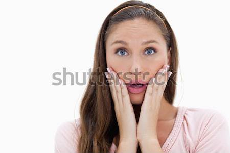 Close-up of a surprised young woman against white background Stock photo © wavebreak_media