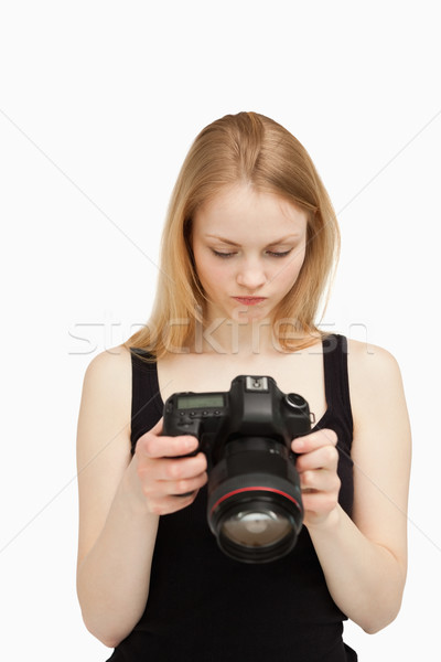 Kobieta patrząc ekranu kamery biały ręce Zdjęcia stock © wavebreak_media