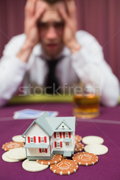 Man risking his house at poker game in casio Stock photo © wavebreak_media