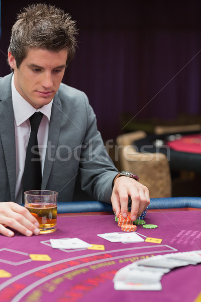 Man looking down at poker table in casino Stock photo © wavebreak_media