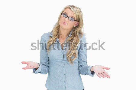 Woman wearing glasses and looking questioningly Stock photo © wavebreak_media