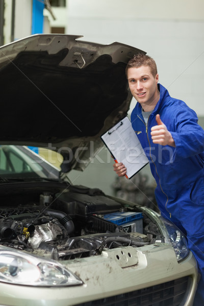 Mechanic by car showing thumbs up Stock photo © wavebreak_media