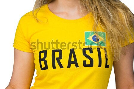 Fit girl in green bikini holding brasil football  Stock photo © wavebreak_media