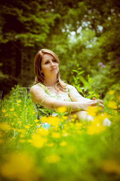 Cute young woman relaxing in field Stock photo © wavebreak_media