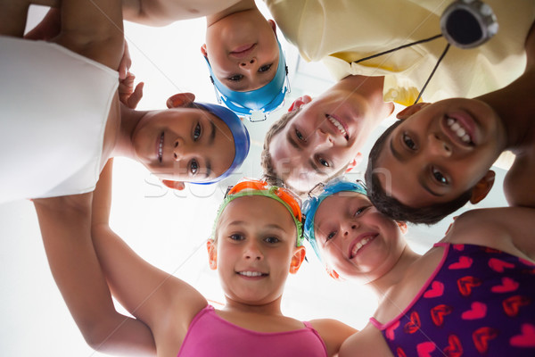 Swimming coach with his students poolside Stock photo © wavebreak_media