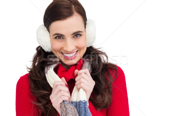 Happy brunette in winter clothes smiling at camera  Stock photo © wavebreak_media