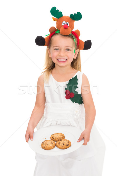 Festive little girl holding fresh cookies Stock photo © wavebreak_media