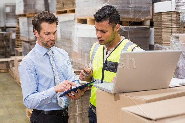 Warehouse worker and manager working together Stock photo © wavebreak_media