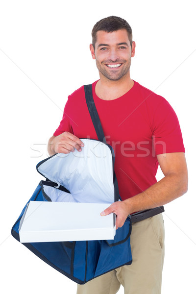 Delivery man removing pizza box from bag Stock photo © wavebreak_media