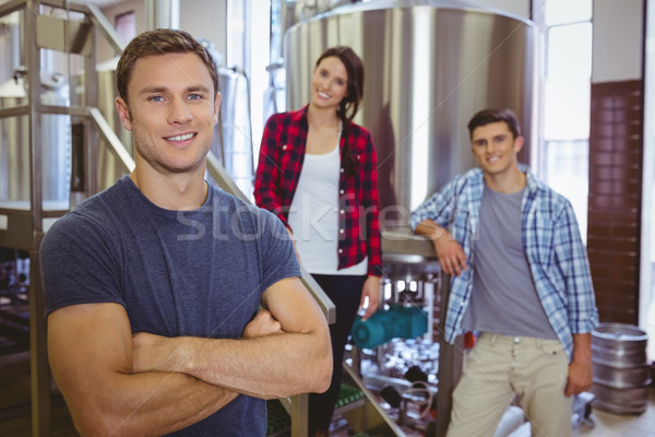 Casual happy stylish team smiling at camera together Stock photo © wavebreak_media