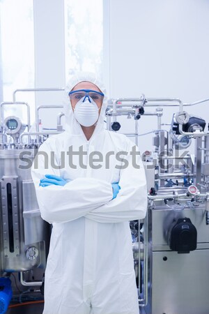 Scientist in protective suit standing with arms crossed Stock photo © wavebreak_media