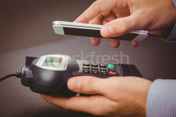 Man using smartphone to express pay  Stock photo © wavebreak_media