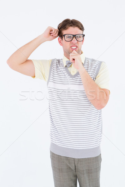 Geeky hipster thinking with hand on chin Stock photo © wavebreak_media