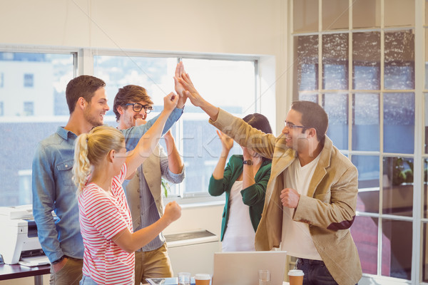 Happy business team doing hands checks Stock photo © wavebreak_media