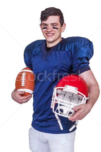 American football player holding a ball and helmet Stock photo © wavebreak_media