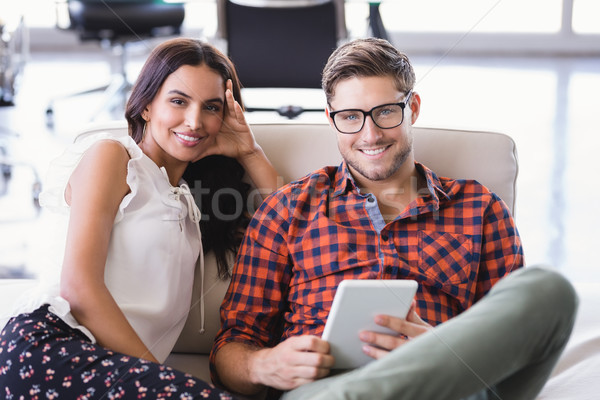 Portrait of smiling business people sitting in office Stock photo © wavebreak_media
