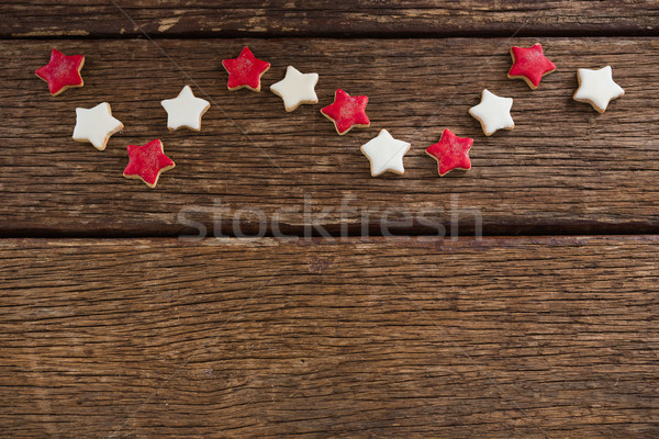 Red and white sugar cookies arranged on wooden table Stock photo © wavebreak_media