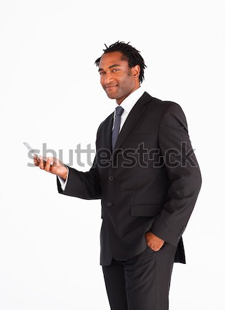 Confident businessman with hands in pockets touching invisible interface Stock photo © wavebreak_media