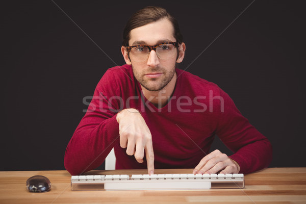 Portrait of man pointing at keyboard Stock photo © wavebreak_media