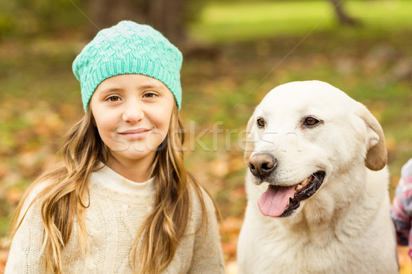 Smiling young girl with her dog Stock photo © wavebreak_media