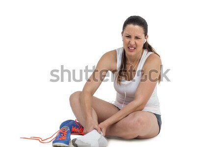 Athlete woman with foot pain on white background Stock photo © wavebreak_media
