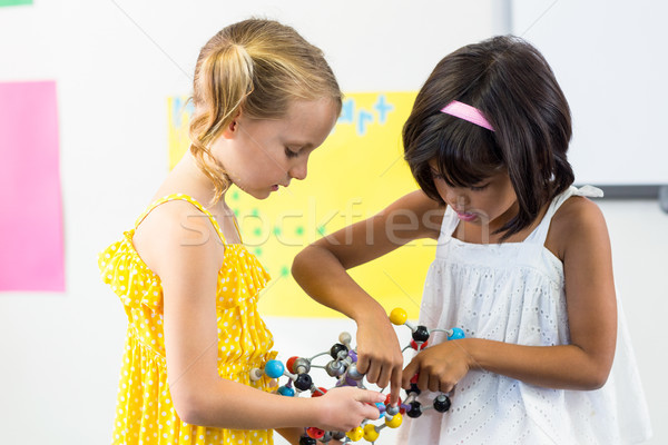 Cute girls with DNA model Stock photo © wavebreak_media