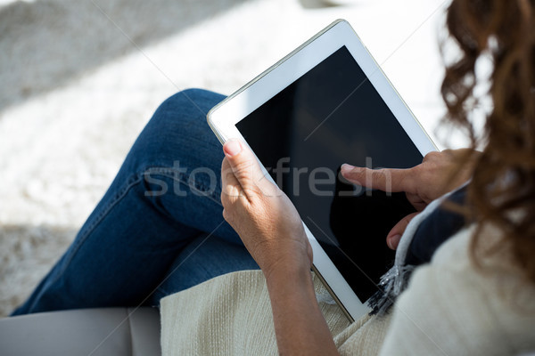 Woman using digital tablet Stock photo © wavebreak_media