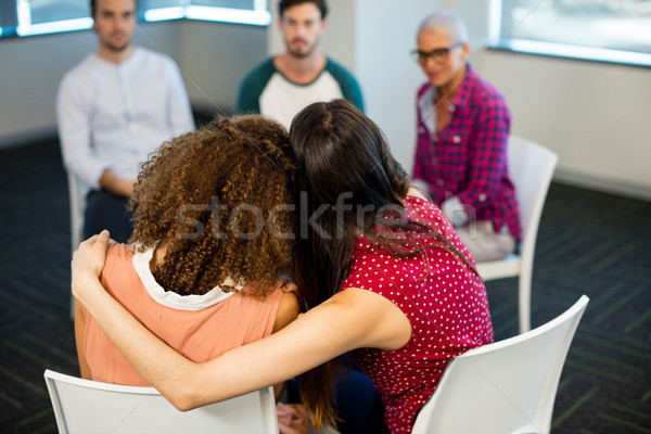Stock photo: Creative businesswoman embracing each other at office