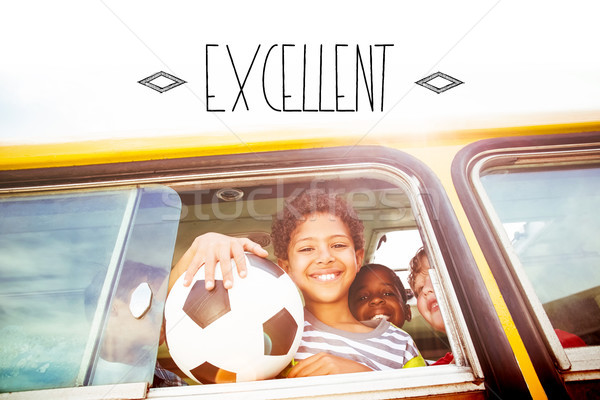 Excellent! against cute pupils smiling at camera in the school b Stock photo © wavebreak_media