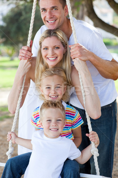 Jolly family swinging  Stock photo © wavebreak_media