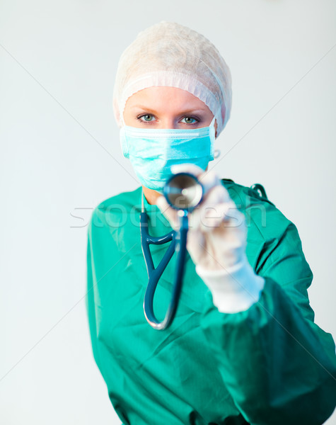 Surgeon holding stethescope outwards  Stock photo © wavebreak_media