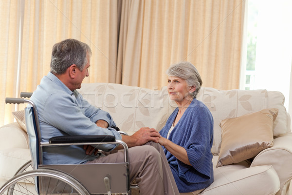Senior couple talking in the living room at home Stock photo © wavebreak_media