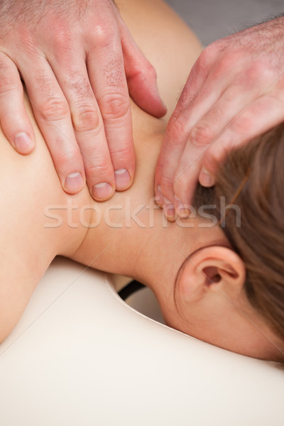 Doctor massaging the neck of his patient in a room Stock photo © wavebreak_media