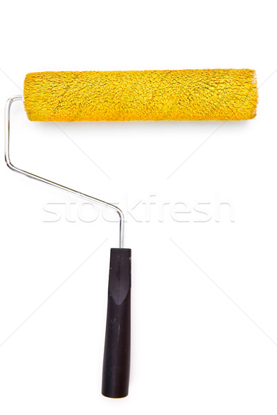 Yellow paint roller on white background Stock photo © wavebreak_media