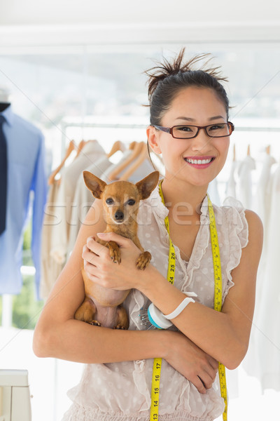 Beautiful female fashion designer with chihuahua Stock photo © wavebreak_media
