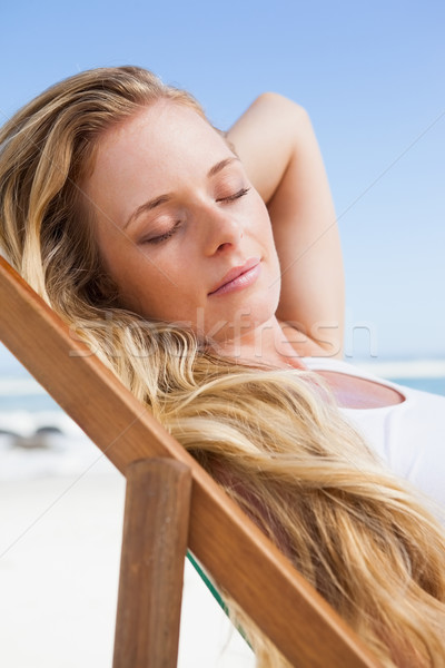 Przepiękny posiedzenia plaży Zdjęcia stock © wavebreak_media