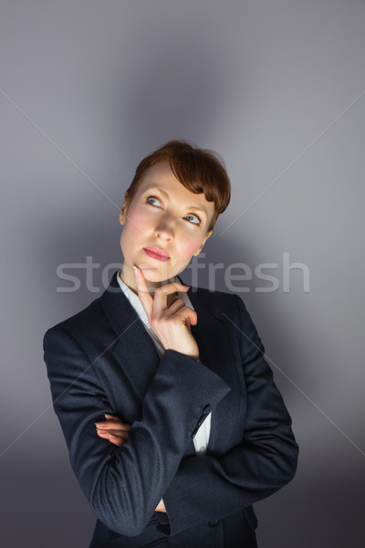 Mujer de negocios traje pensando dedo barbilla gris Foto stock © wavebreak_media