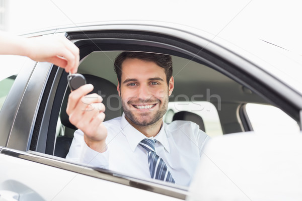 Businessman getting his new car key Stock photo © wavebreak_media