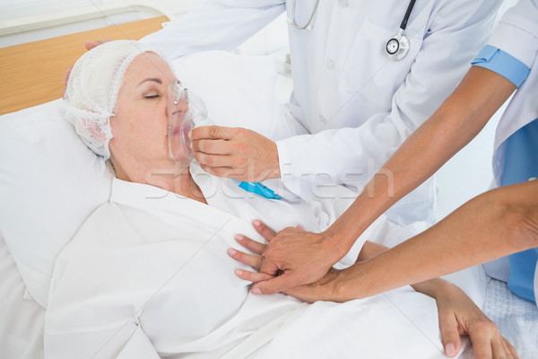 Doctor putting an oxygen mask Stock photo © wavebreak_media