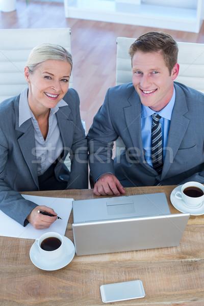 Smiling business people using laptop Stock photo © wavebreak_media