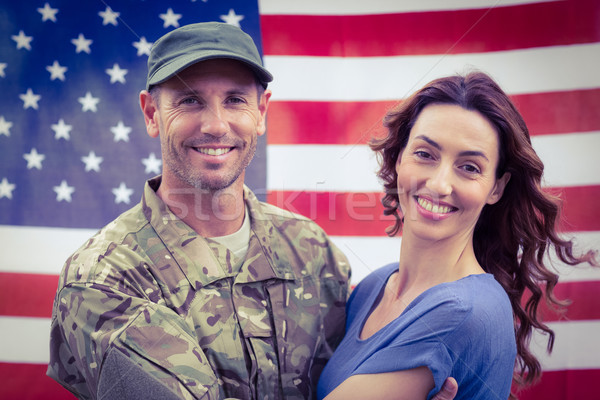 Bonito soldado parceiro bandeira americana mulher feliz Foto stock © wavebreak_media