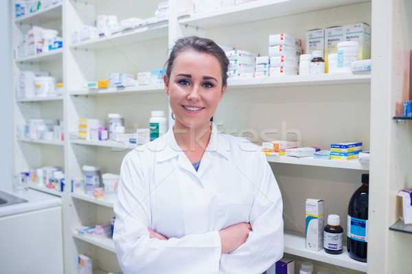 Stock photo: Portrait of a smiling student in lab coat with arms crossed