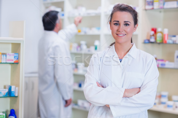 Smiling trainee standing with arms crossed Stock photo © wavebreak_media