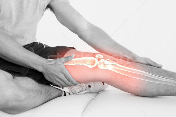 Rodilla herido hombre compuesto digital manos médicos Foto stock © wavebreak_media