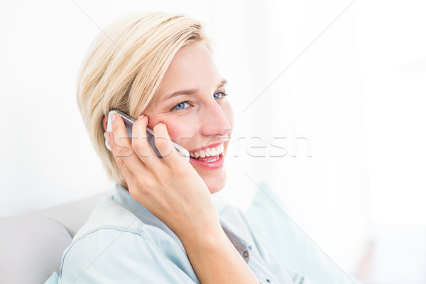 Pretty blonde woman calling on the phone Stock photo © wavebreak_media