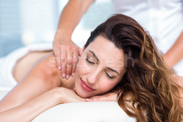 Smiling brunette getting back massage Stock photo © wavebreak_media