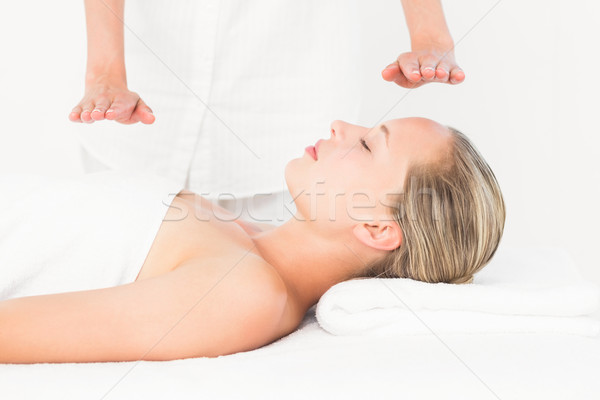 Calm woman receiving reiki treatment Stock photo © wavebreak_media