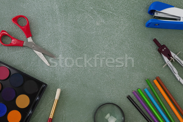 Various school supplies arranged on chalkboard Stock photo © wavebreak_media