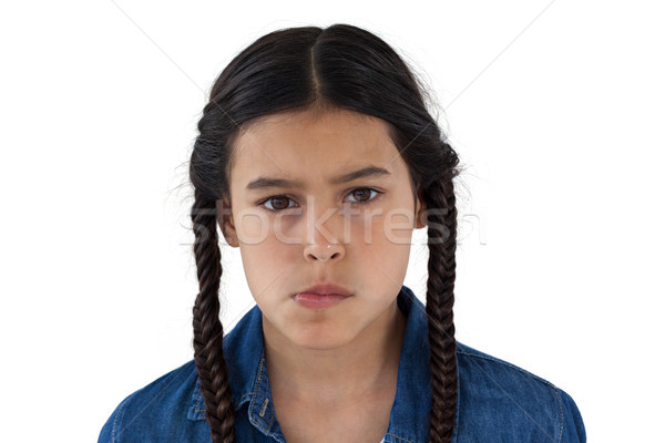 Sad girl standing against white background Stock photo © wavebreak_media