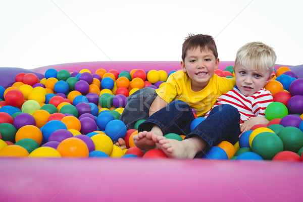 Cute smiling boys in sponge ball pool Stock photo © wavebreak_media